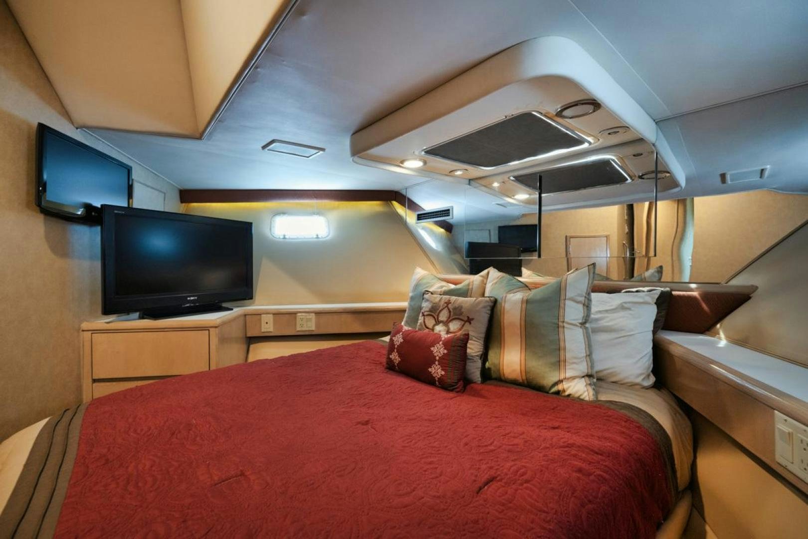 a bed in a room aboard HATT'S OFF Yacht for Sale