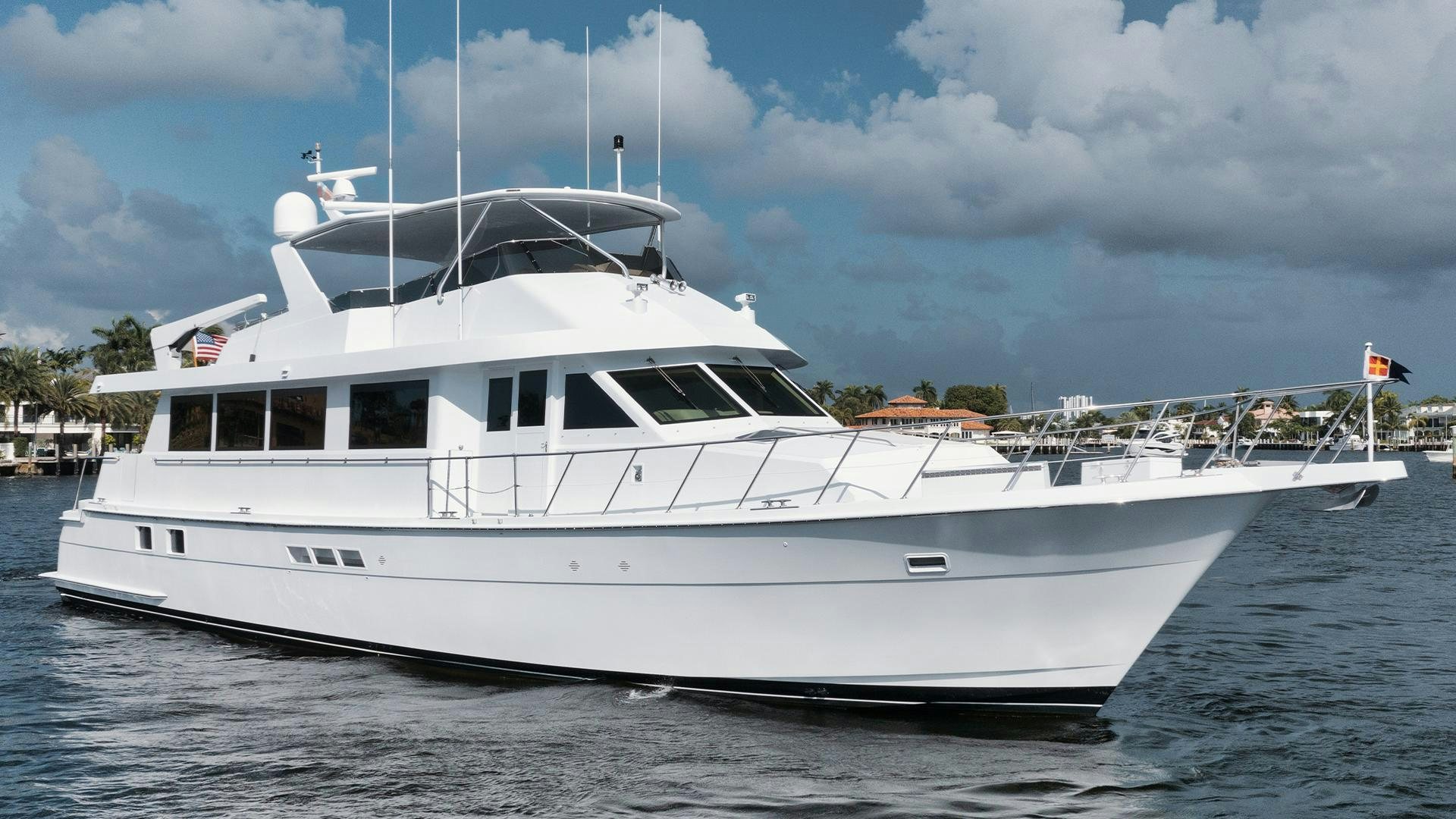 a white yacht on the water aboard HATT'S OFF Yacht for Sale