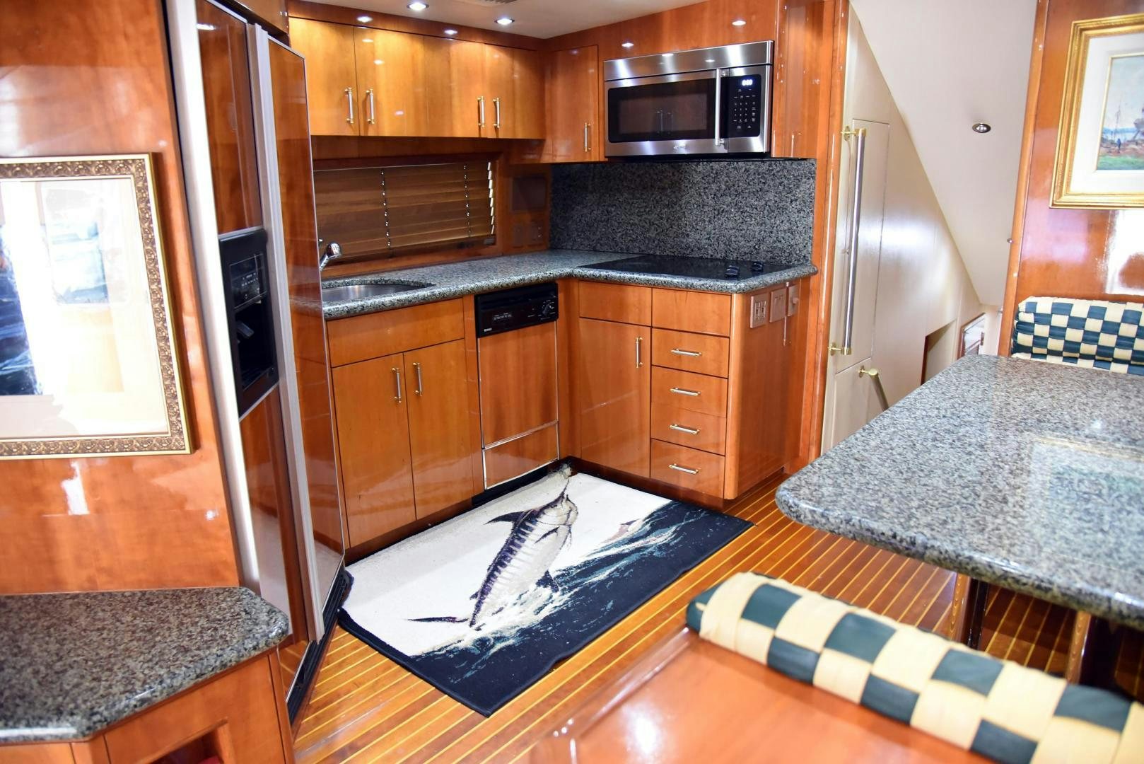 a kitchen with a large refrigerator aboard SALSA Yacht for Sale