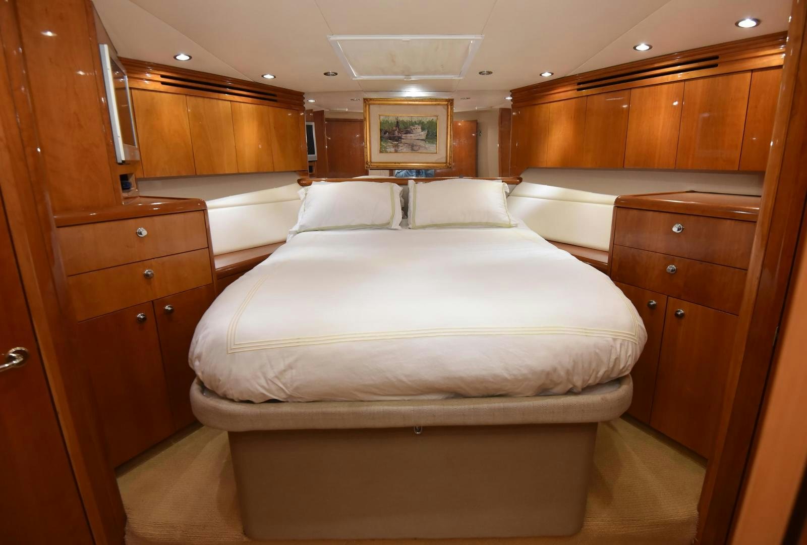 a room with a bed and cabinets aboard SALSA Yacht for Sale