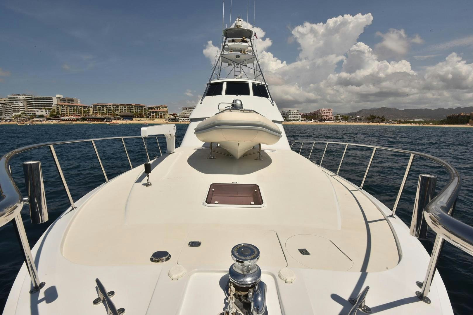 a white yacht on a dock aboard SALSA Yacht for Sale