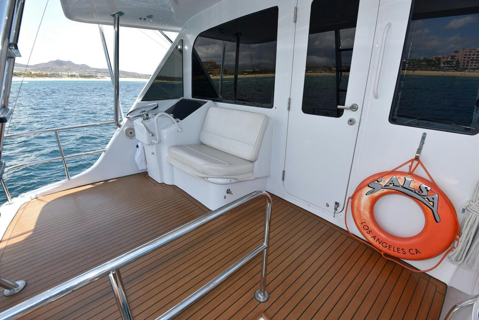 a boat with a steering wheel aboard SALSA Yacht for Sale