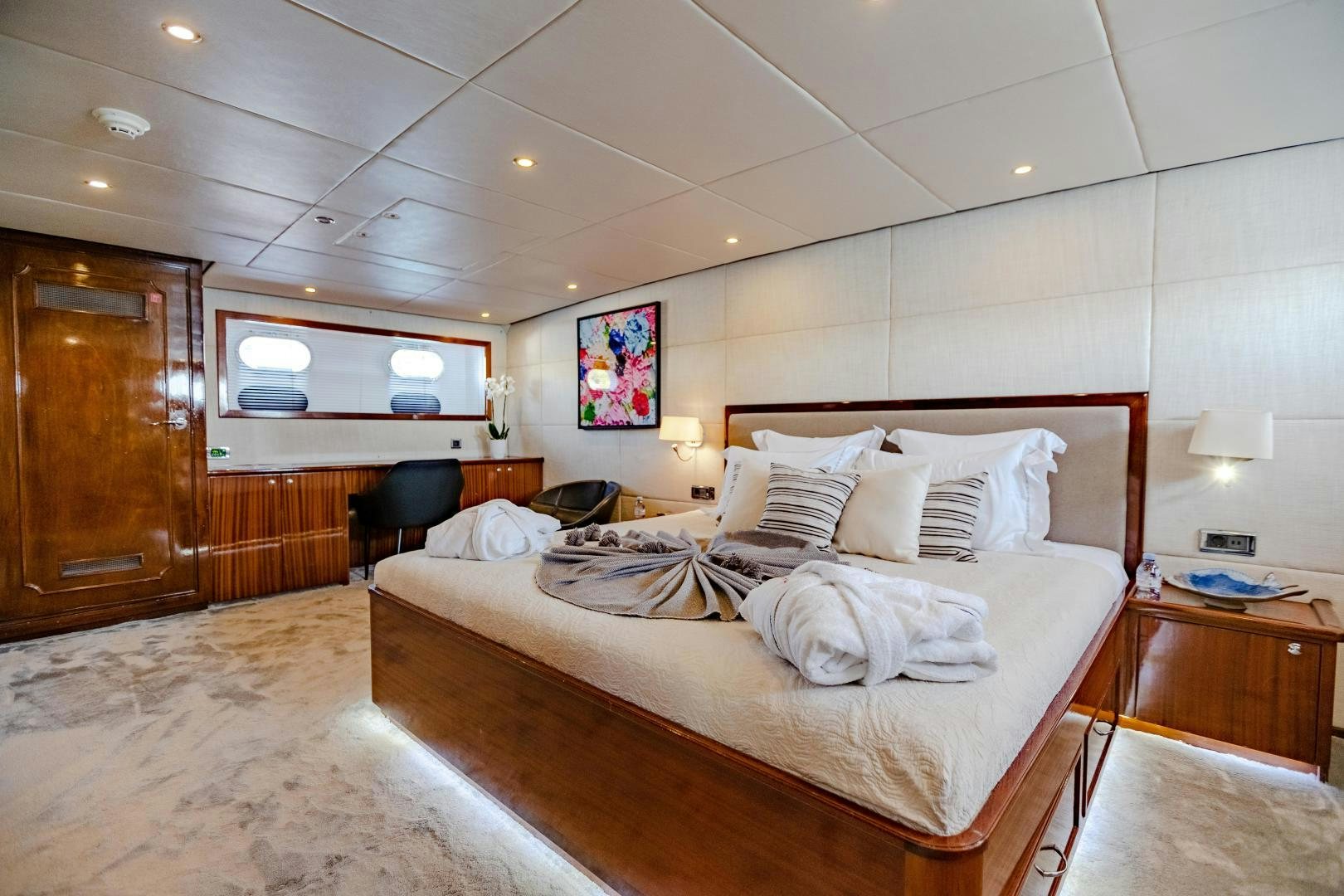 a hotel room with a bed and a desk aboard ALHAMBRA Yacht for Sale