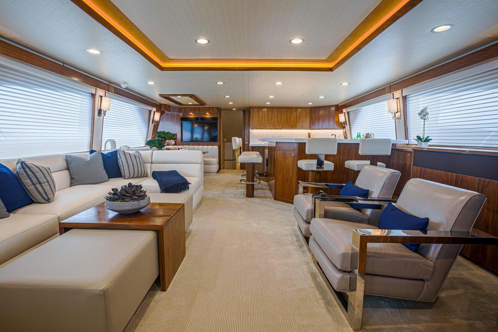 a living room with a couch and a coffee table aboard SPECULATOR Yacht for Sale