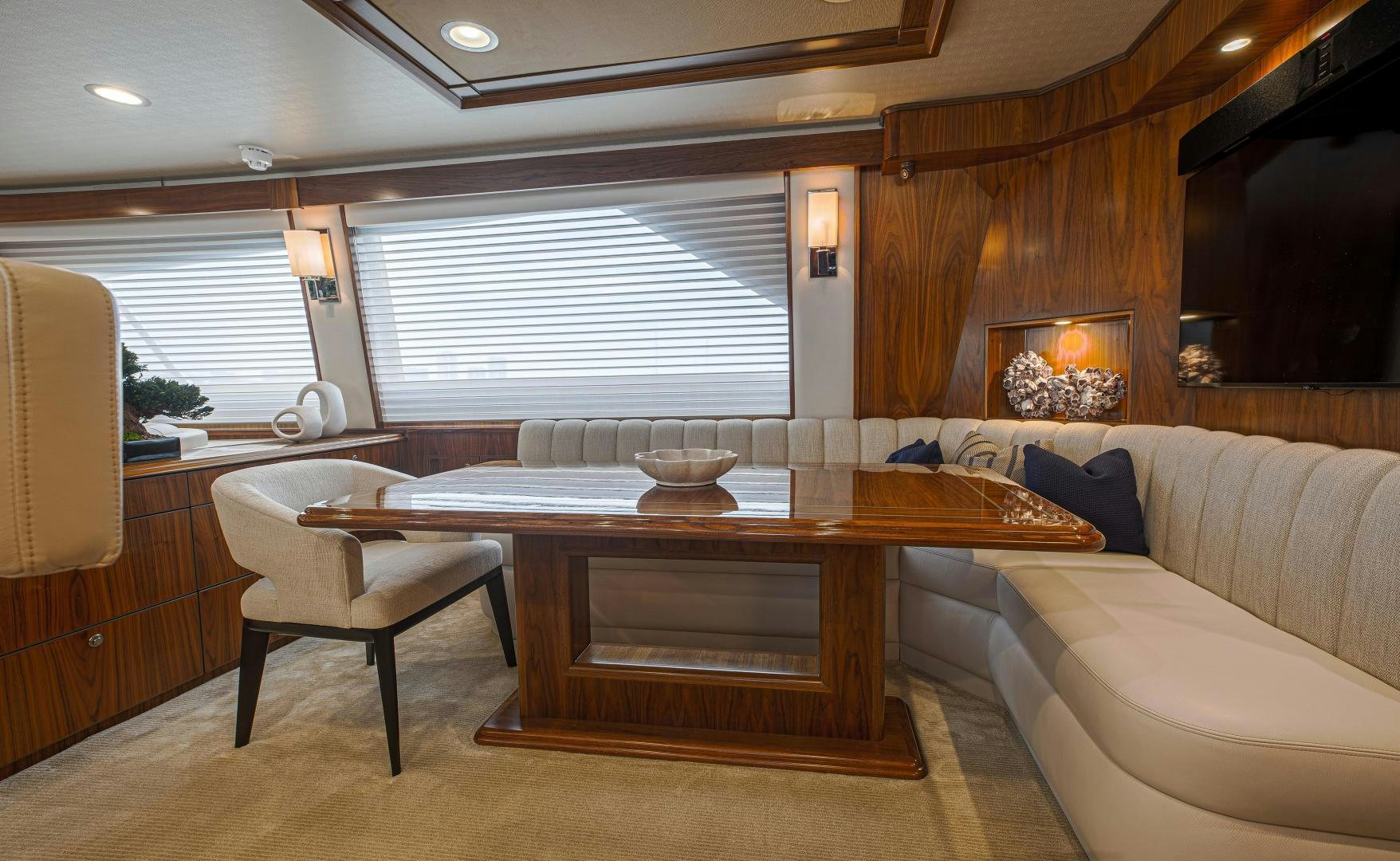 a room with a table and couch aboard SPECULATOR Yacht for Sale
