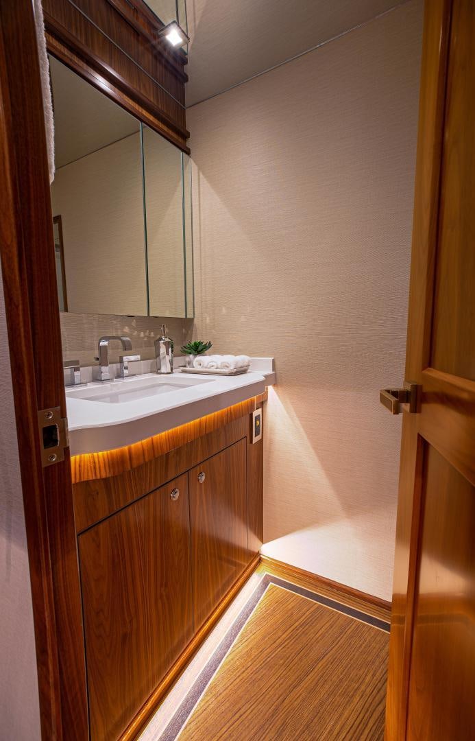 a bathroom with a sink and a mirror aboard SPECULATOR Yacht for Sale