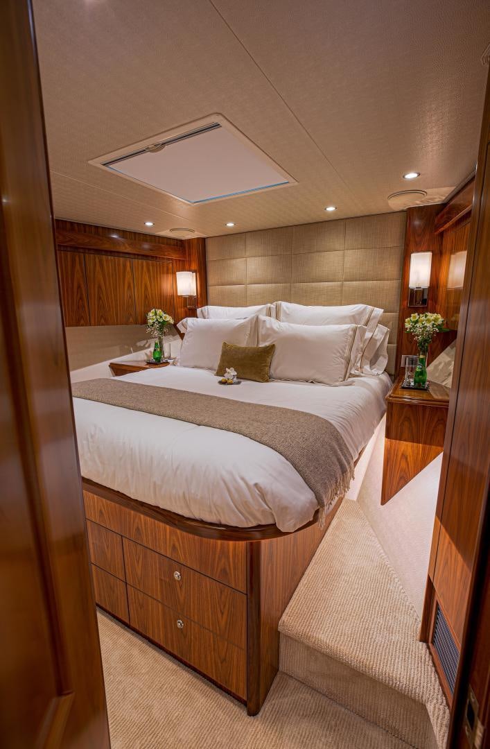 a large bed with a white comforter and a white bed aboard SPECULATOR Yacht for Sale