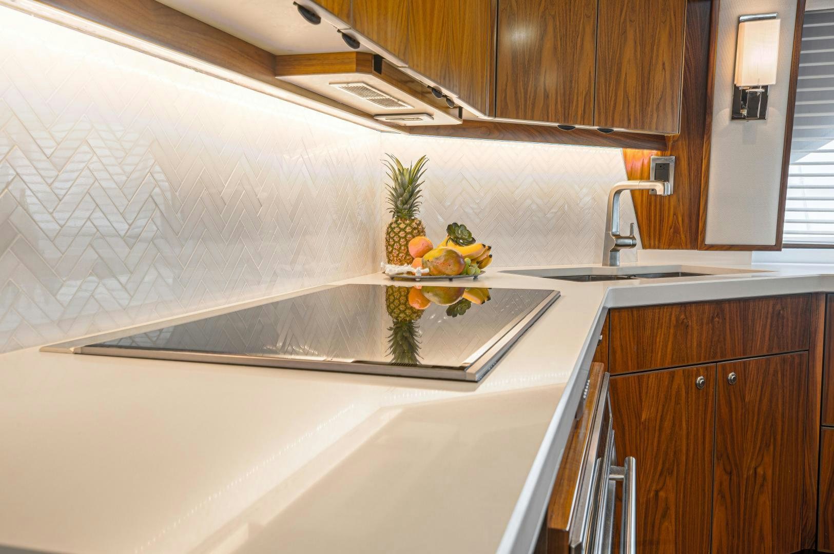 a kitchen with a sink and a countertop aboard SPECULATOR Yacht for Sale