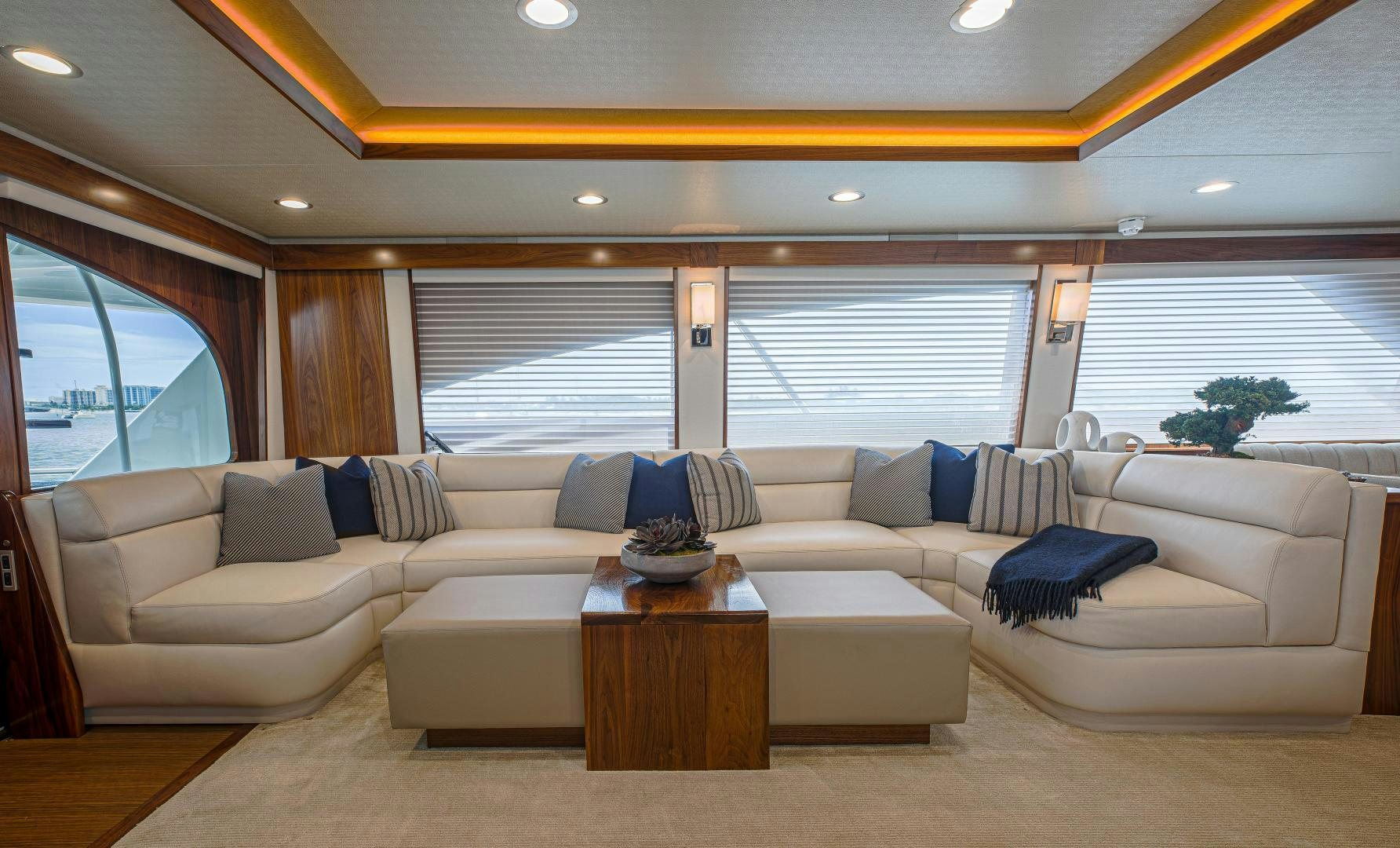 a living room with a couch and a coffee table aboard SPECULATOR Yacht for Sale