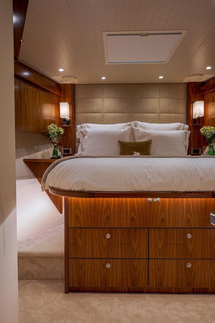 a bed with a white pillow aboard SPECULATOR Yacht for Sale