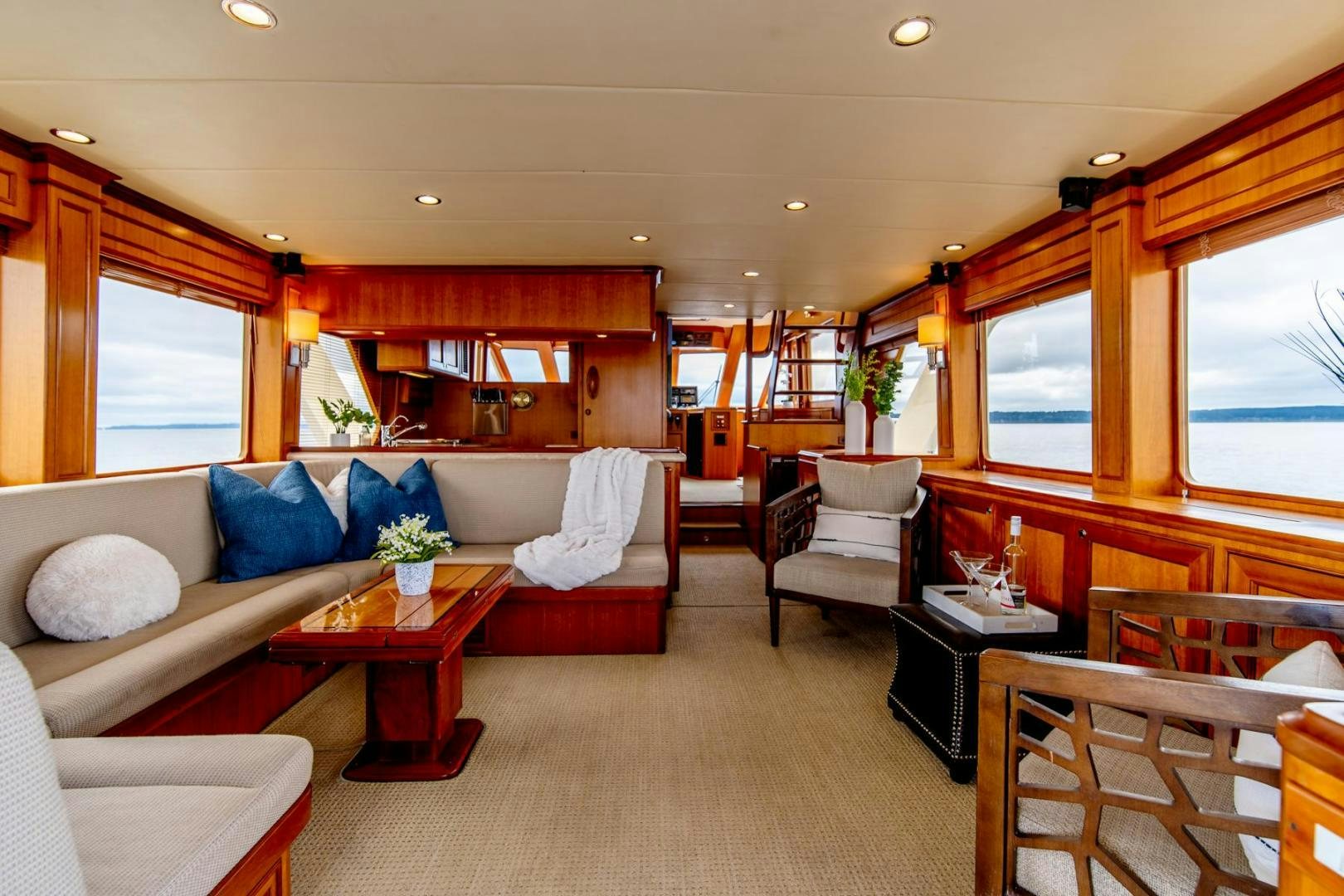 a living room with a couch and a table aboard HONORE Yacht for Sale