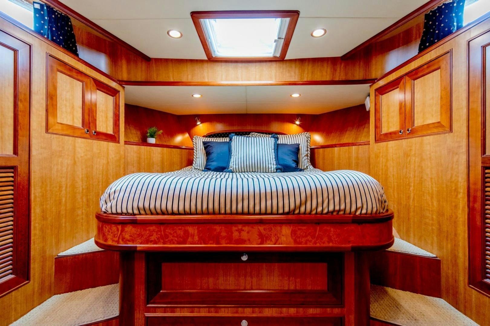 a bed in a room aboard HONORE Yacht for Sale