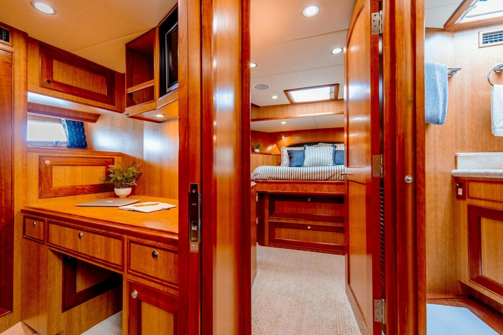a room with wooden cabinets aboard HONORE Yacht for Sale