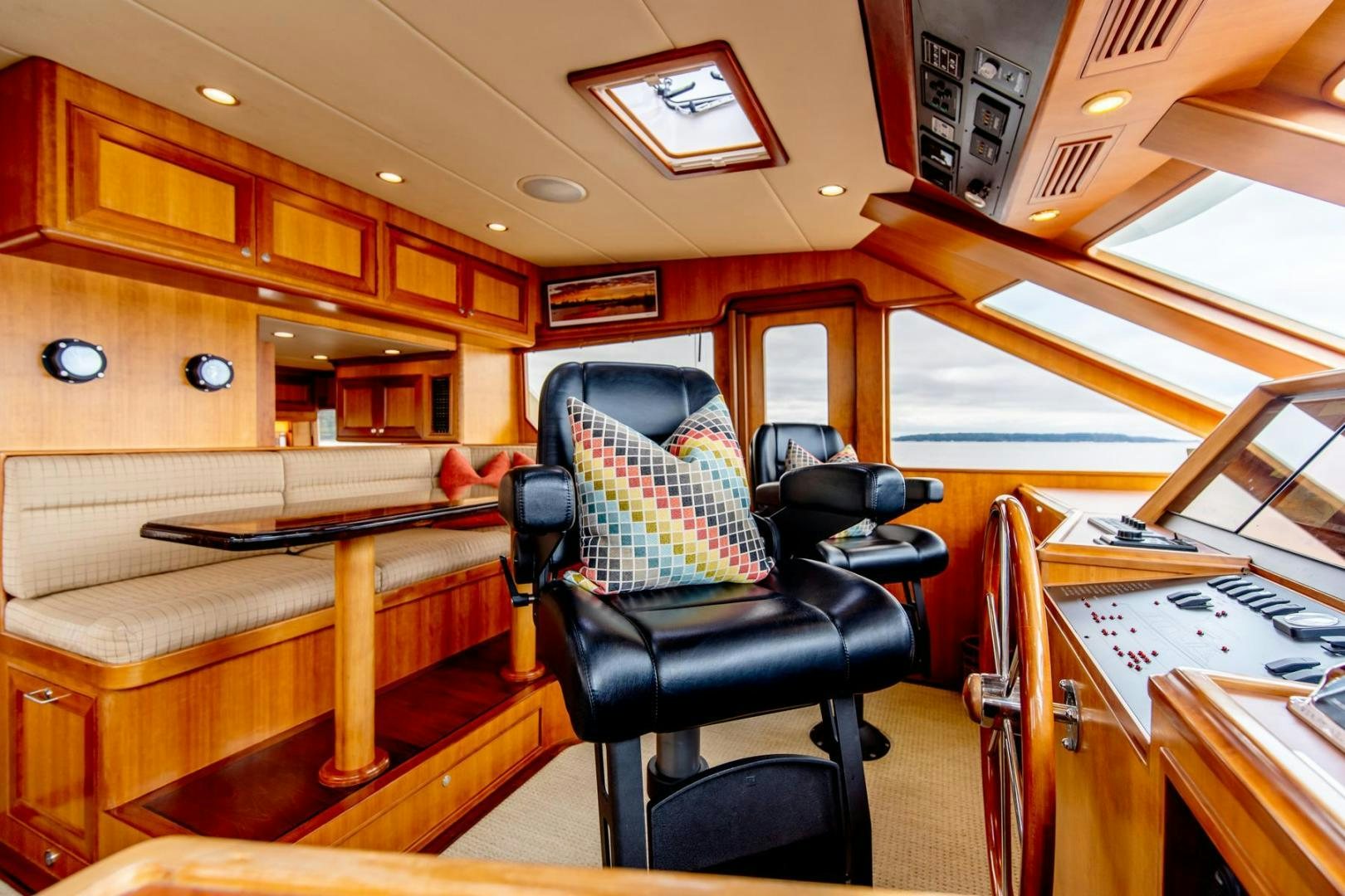 a room with a chair and desk aboard HONORE Yacht for Sale