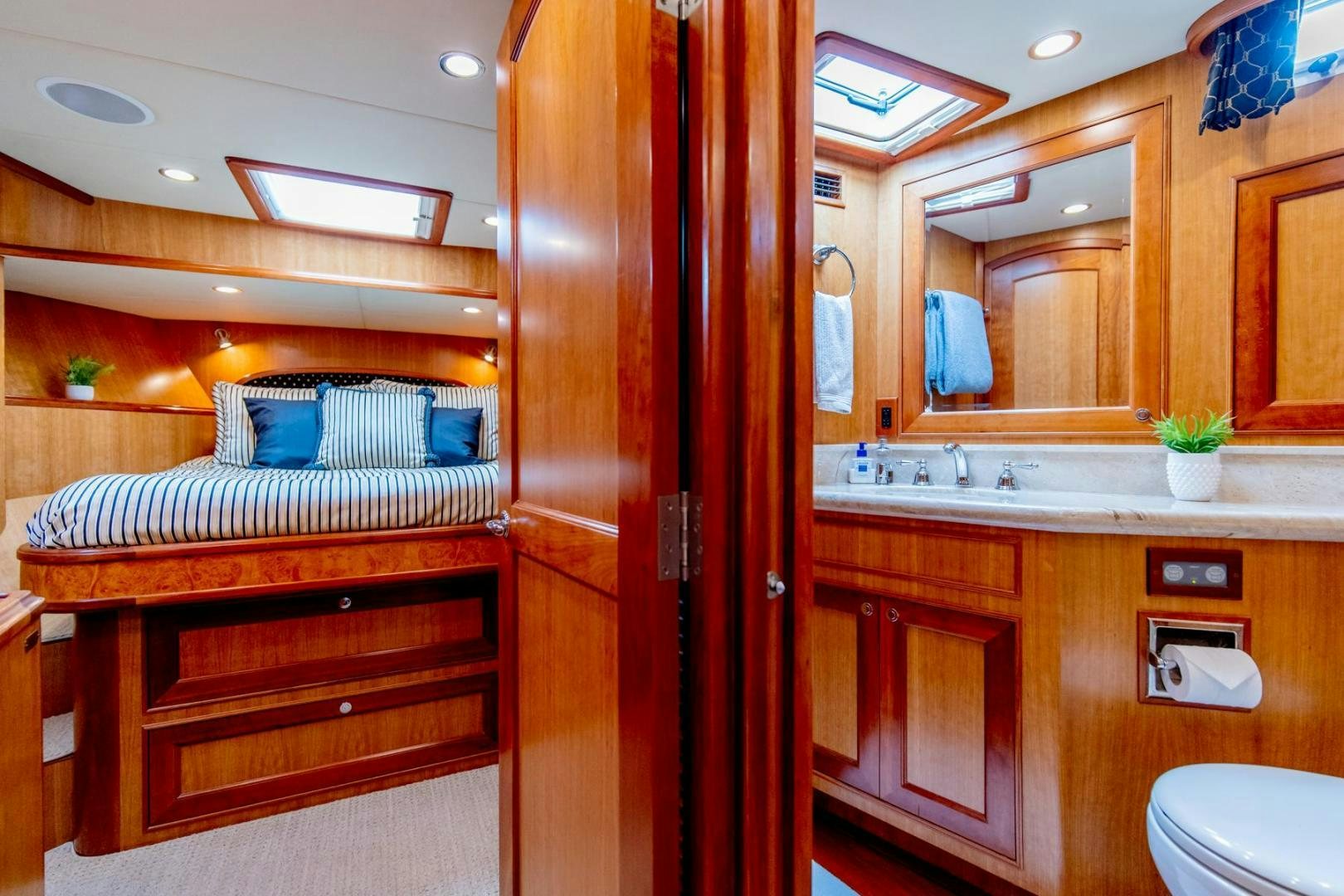 a bathroom with a wood cabinet aboard HONORE Yacht for Sale