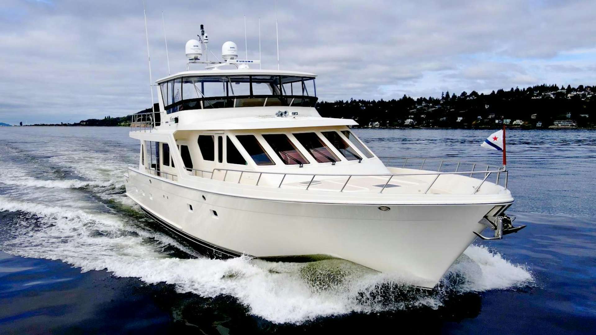 a white boat on the water aboard HONORE Yacht for Sale