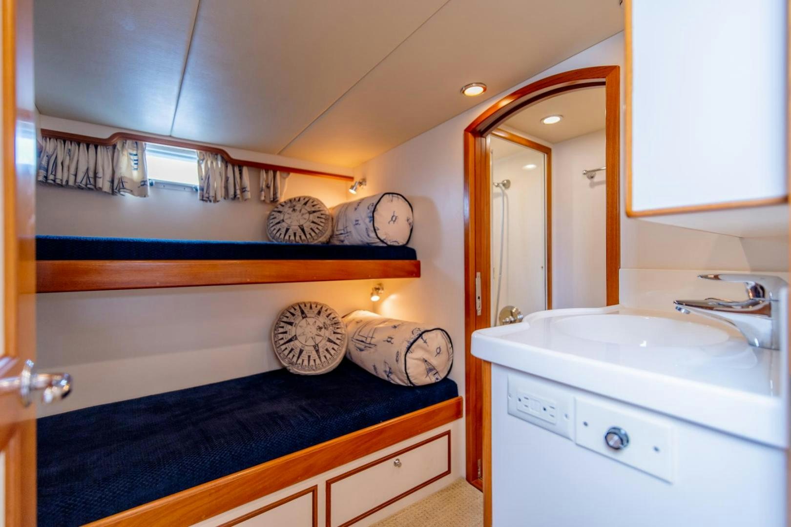 a bathroom with a sink and a mirror aboard HONORE Yacht for Sale