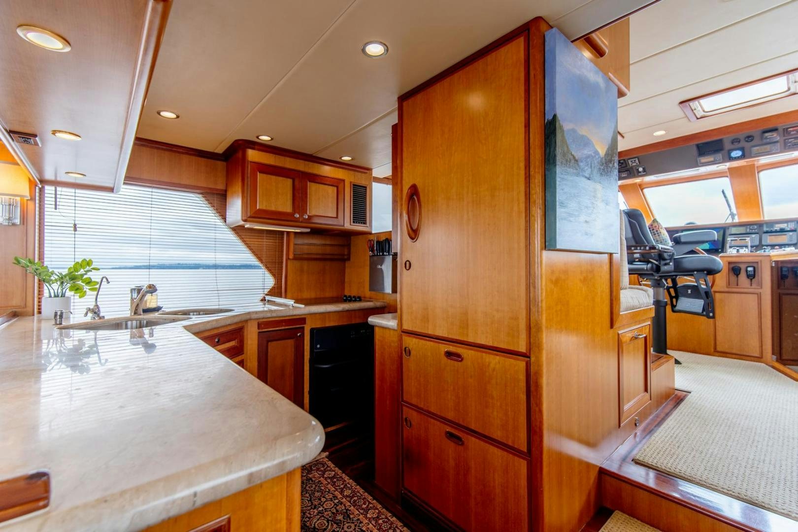 a kitchen with a large island aboard HONORE Yacht for Sale