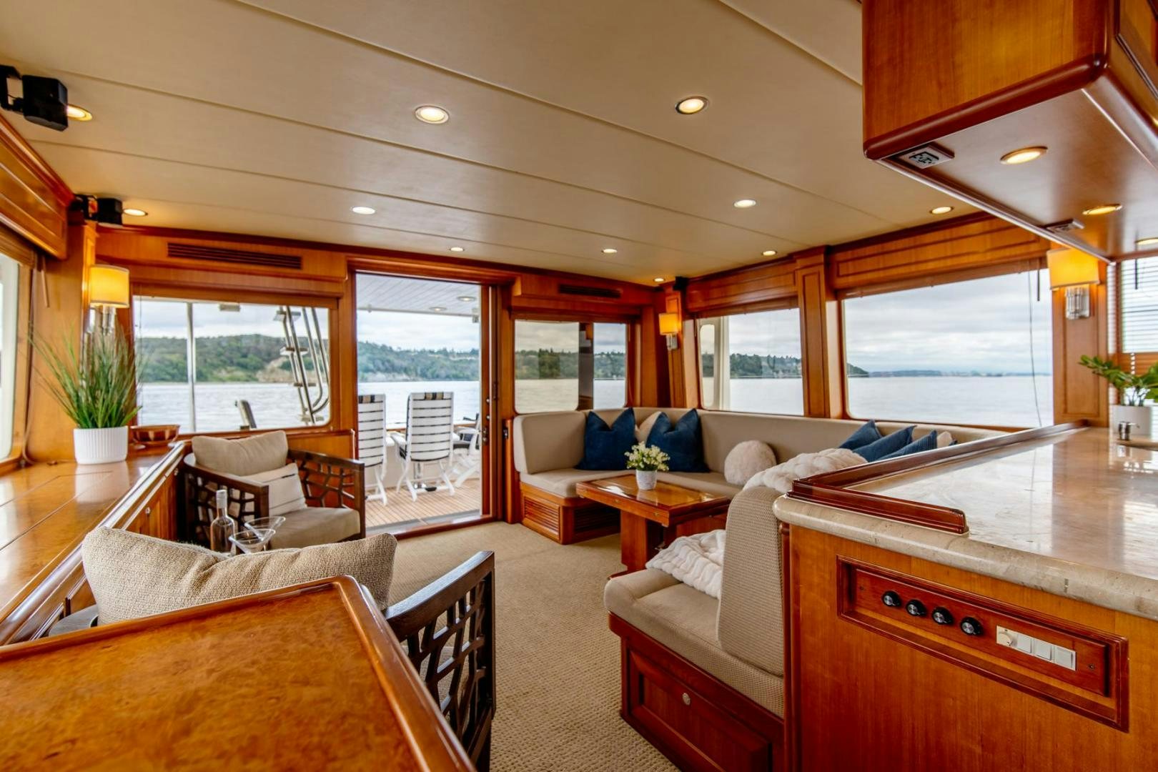 a living room with a large window aboard HONORE Yacht for Sale