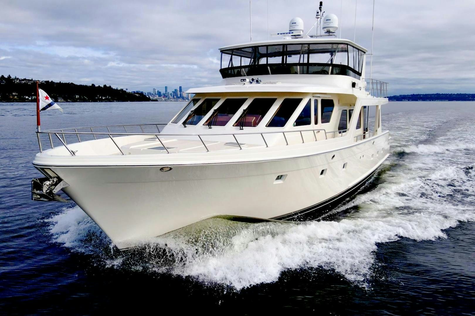 a white boat on water aboard HONORE Yacht for Sale