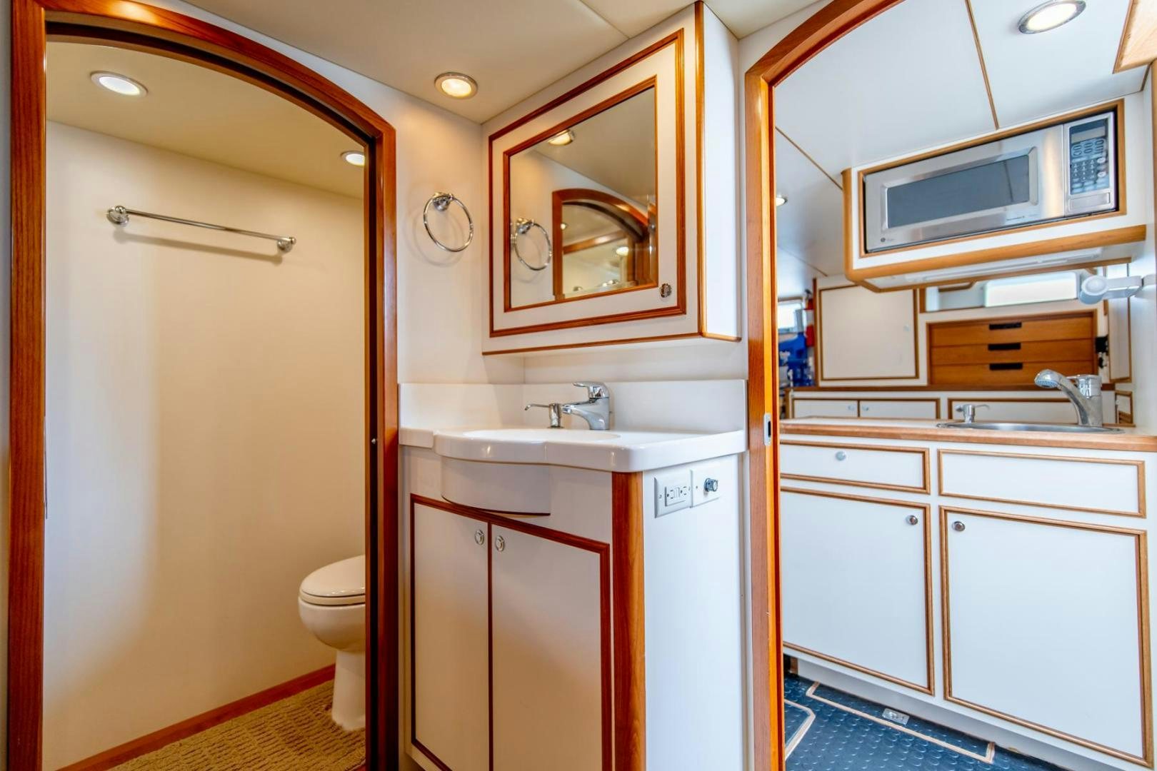 a bathroom with a sink and a toilet aboard HONORE Yacht for Sale