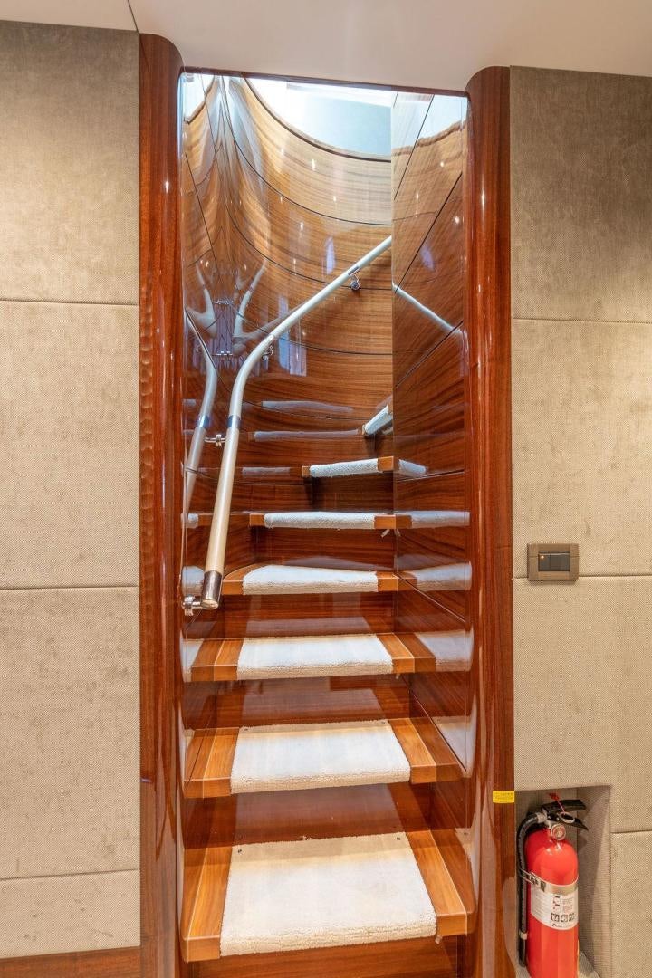 a wooden door with a glass window aboard AQUA LIFE Yacht for Sale