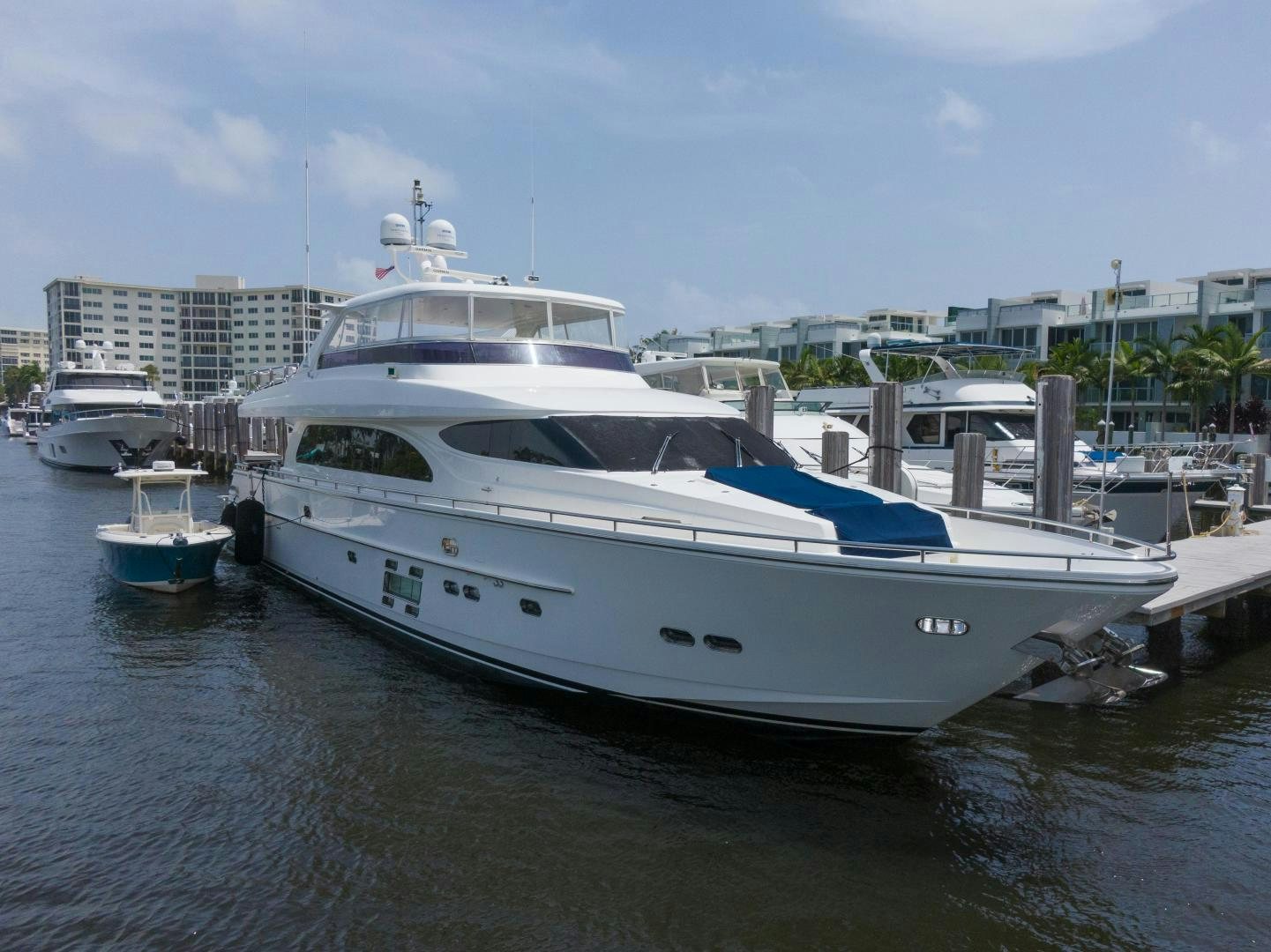 a large white boat sits in a harbor aboard AQUA LIFE Yacht for Sale