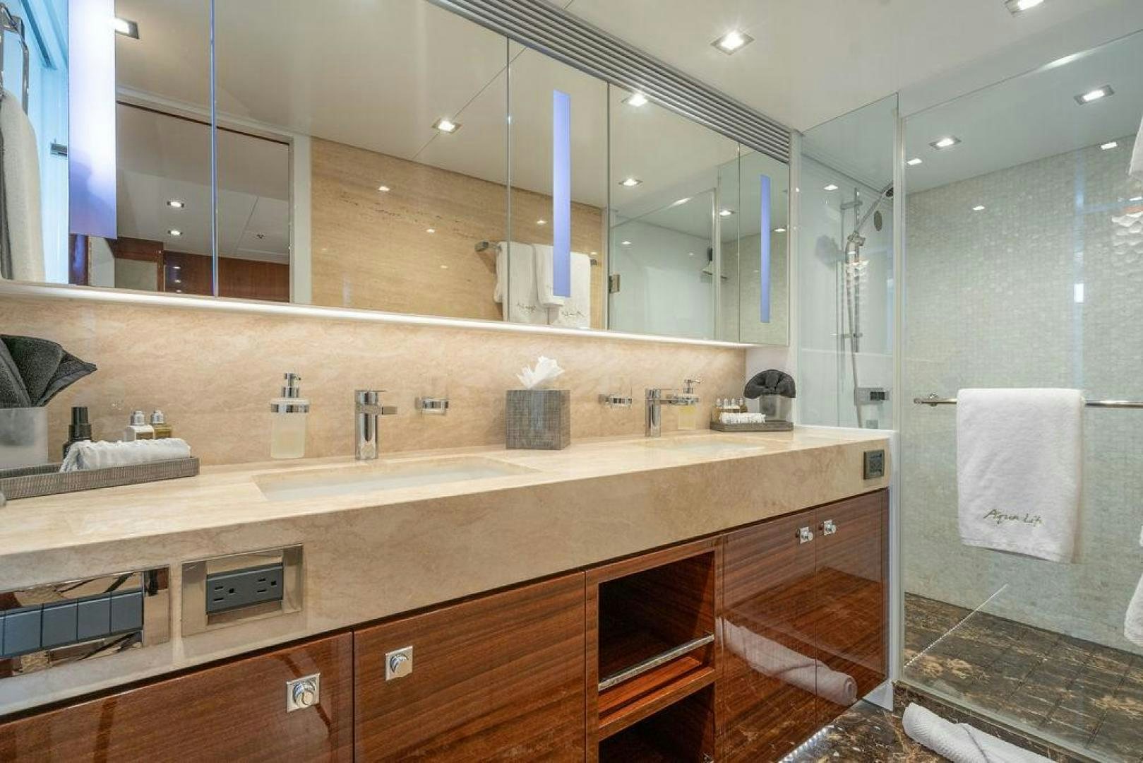 a bathroom with a large mirror aboard AQUA LIFE Yacht for Sale