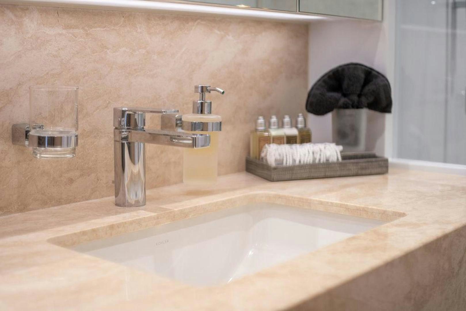a bathroom with a black towel on the counter aboard AQUA LIFE Yacht for Sale