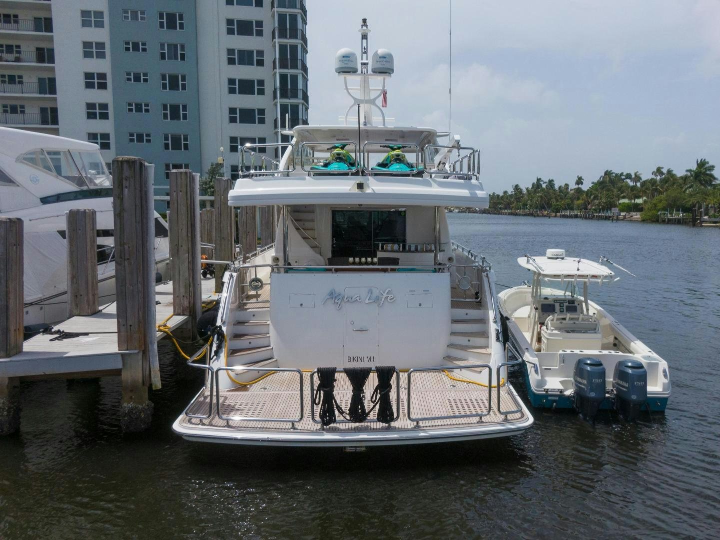 a boat docked at a pier aboard AQUA LIFE Yacht for Sale