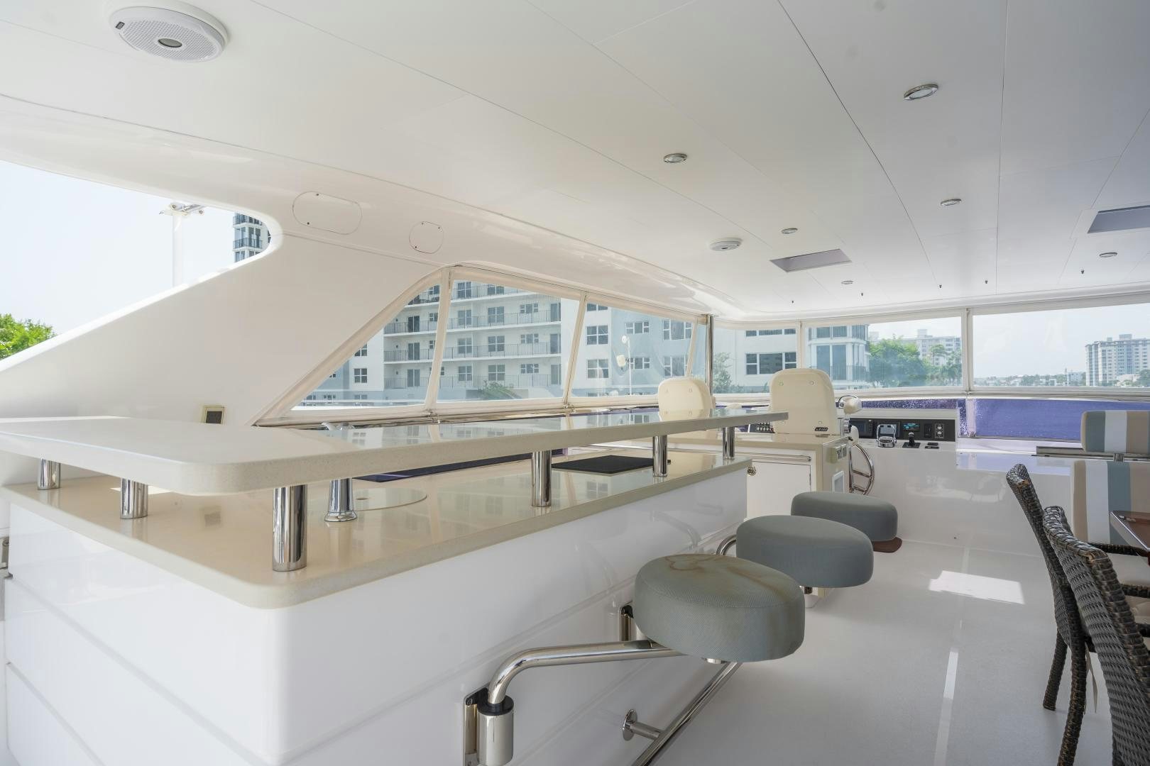 a room with chairs and tables aboard AQUA LIFE Yacht for Sale