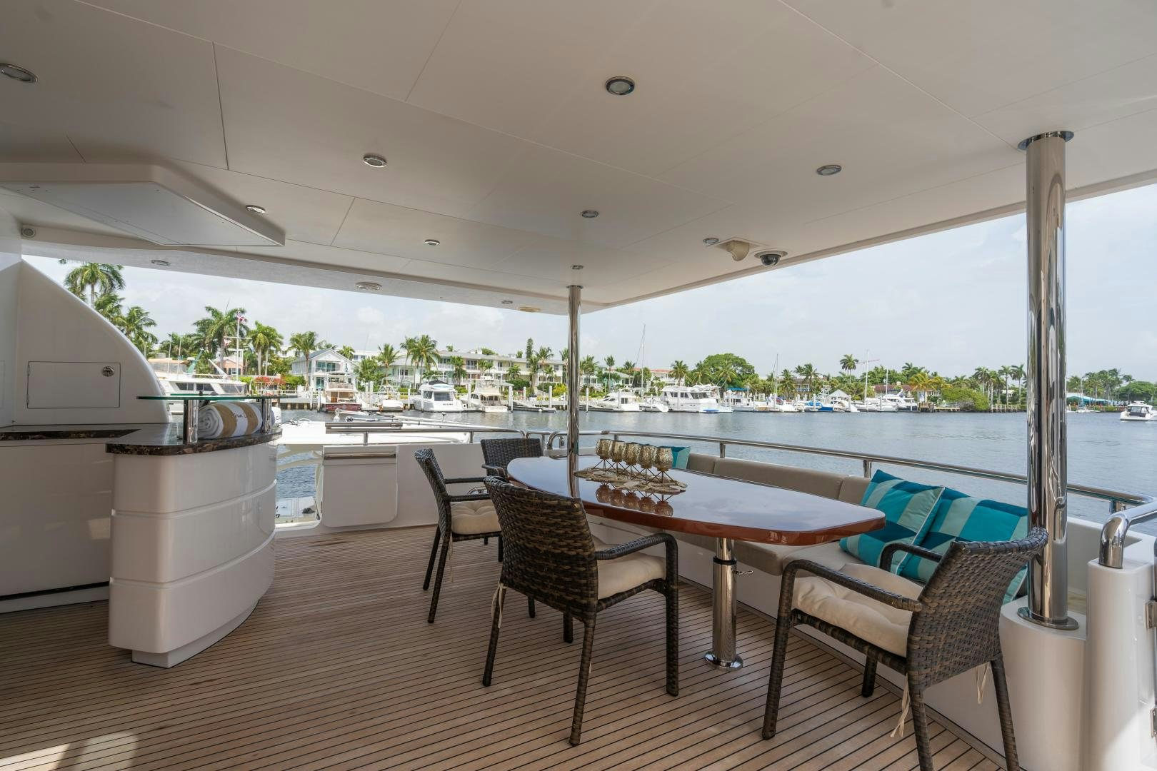 a table and chairs on a deck aboard AQUA LIFE Yacht for Sale