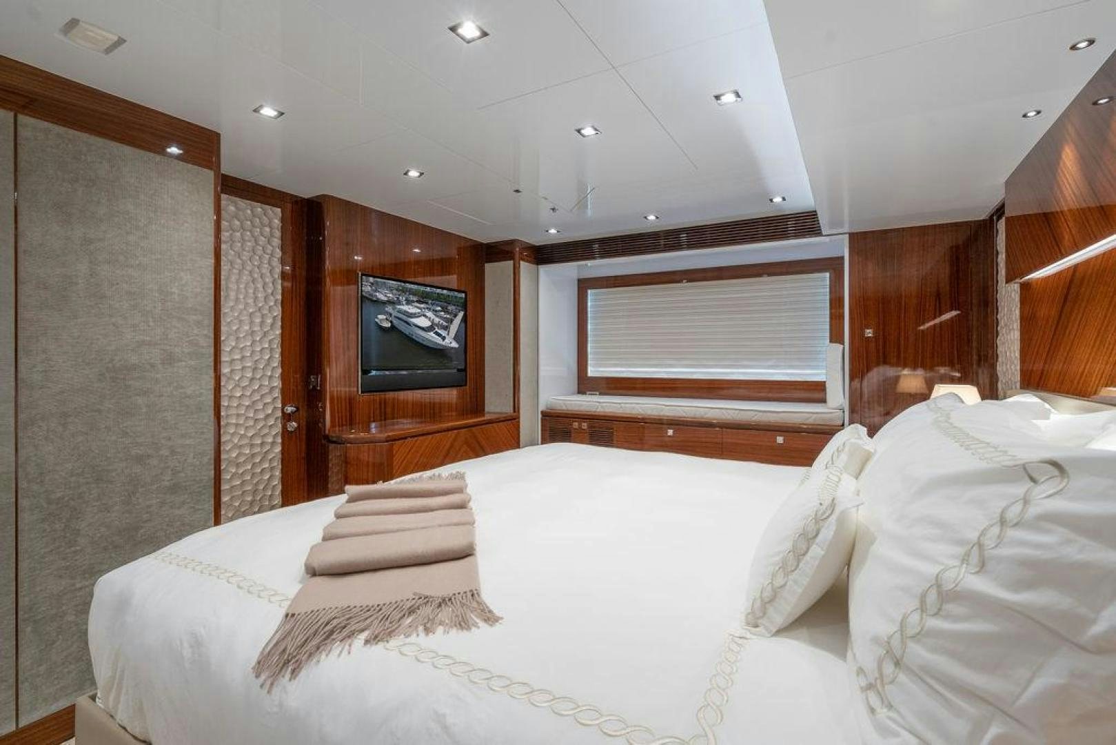 a room with a bed and a television aboard AQUA LIFE Yacht for Sale