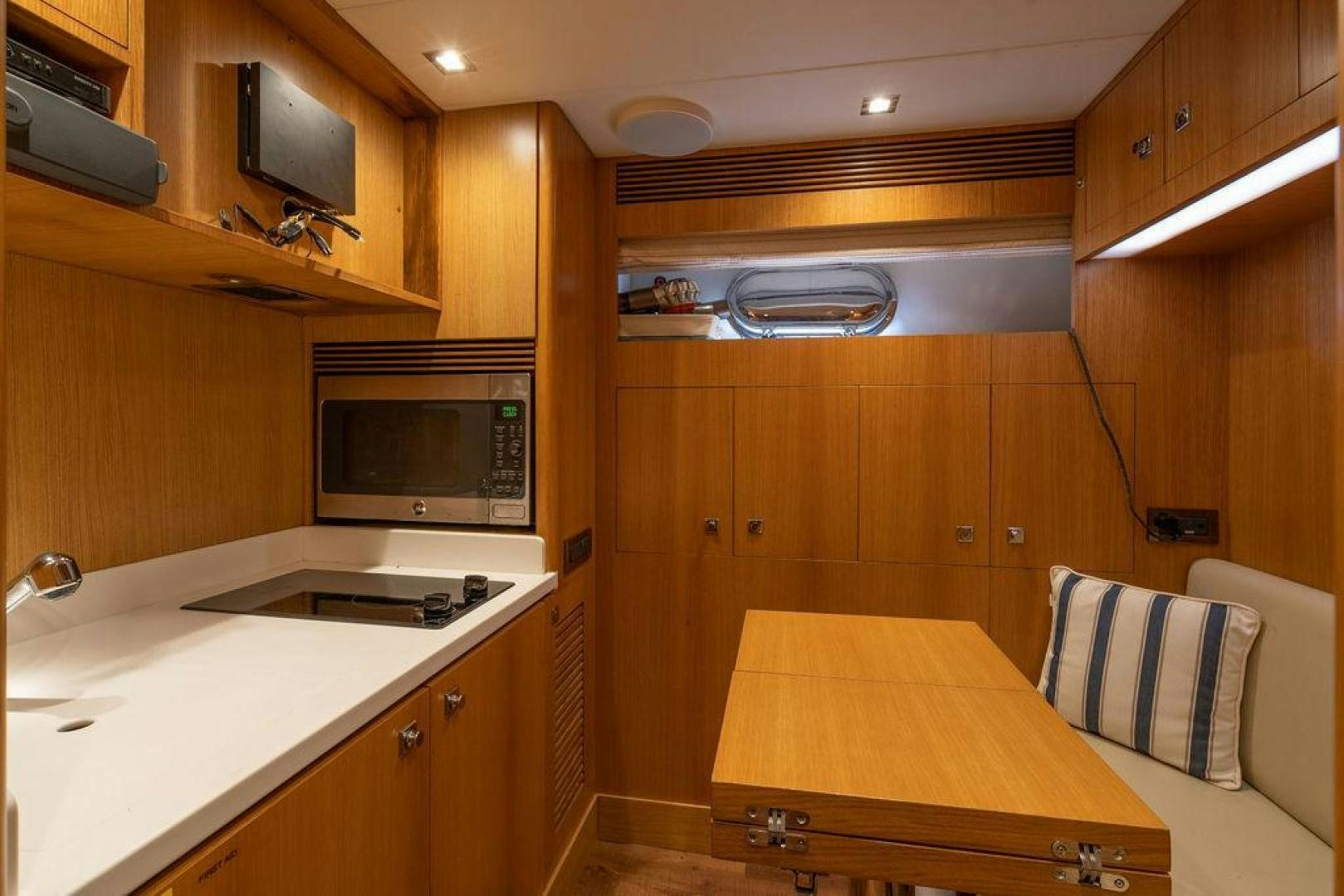 a kitchen with wooden cabinets aboard AQUA LIFE Yacht for Sale