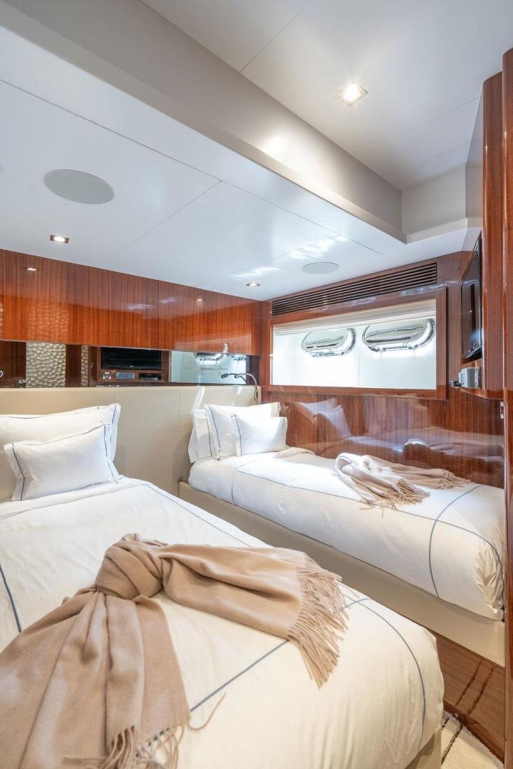 a room with a couple of beds aboard AQUA LIFE Yacht for Sale