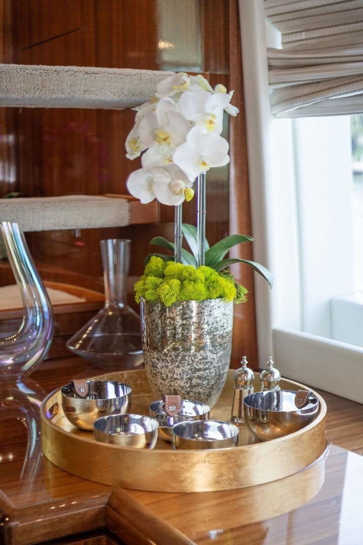 a vase of flowers on a table aboard AQUA LIFE Yacht for Sale