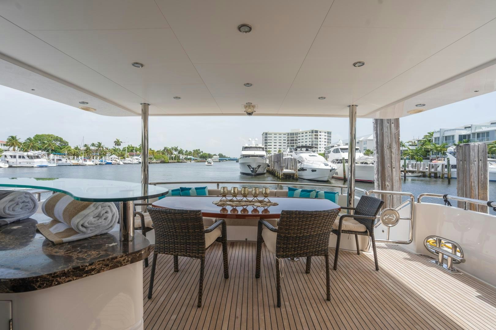 a table and chairs on a deck aboard AQUA LIFE Yacht for Sale