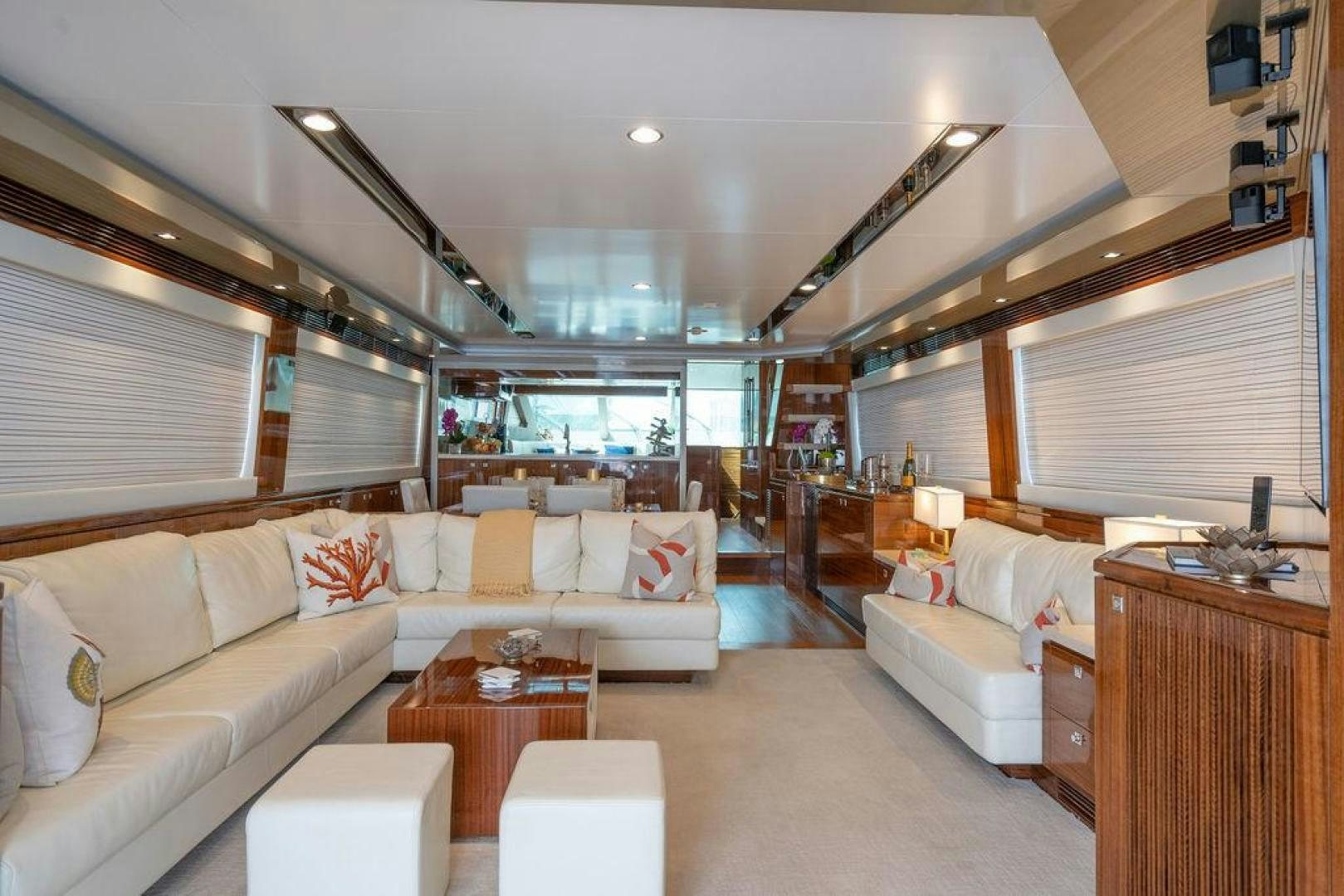 a living room with a couch and a table aboard AQUA LIFE Yacht for Sale