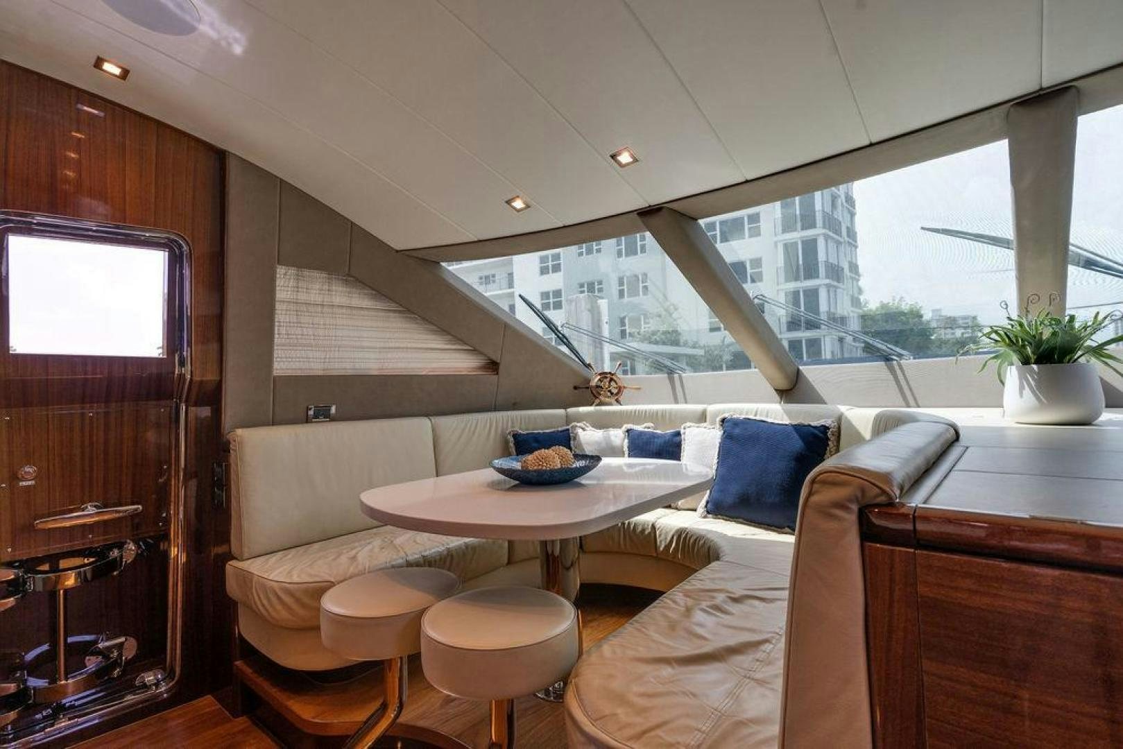 a room with a couch and a table and chairs aboard AQUA LIFE Yacht for Sale