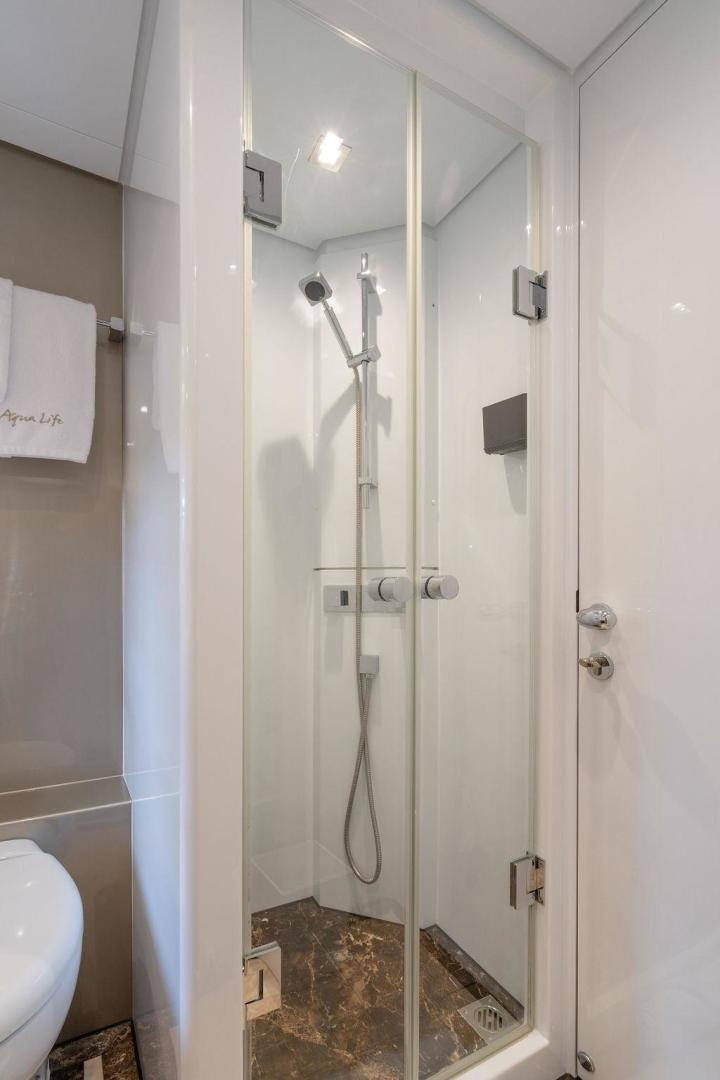 a bathroom with a stand up shower aboard AQUA LIFE Yacht for Sale