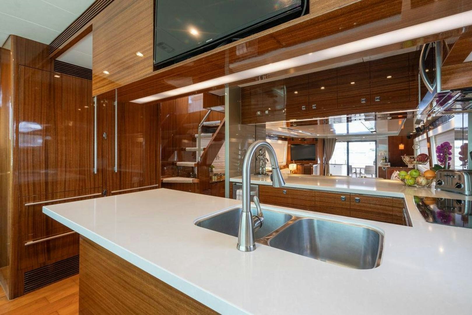a kitchen with a sink and a large window aboard AQUA LIFE Yacht for Sale