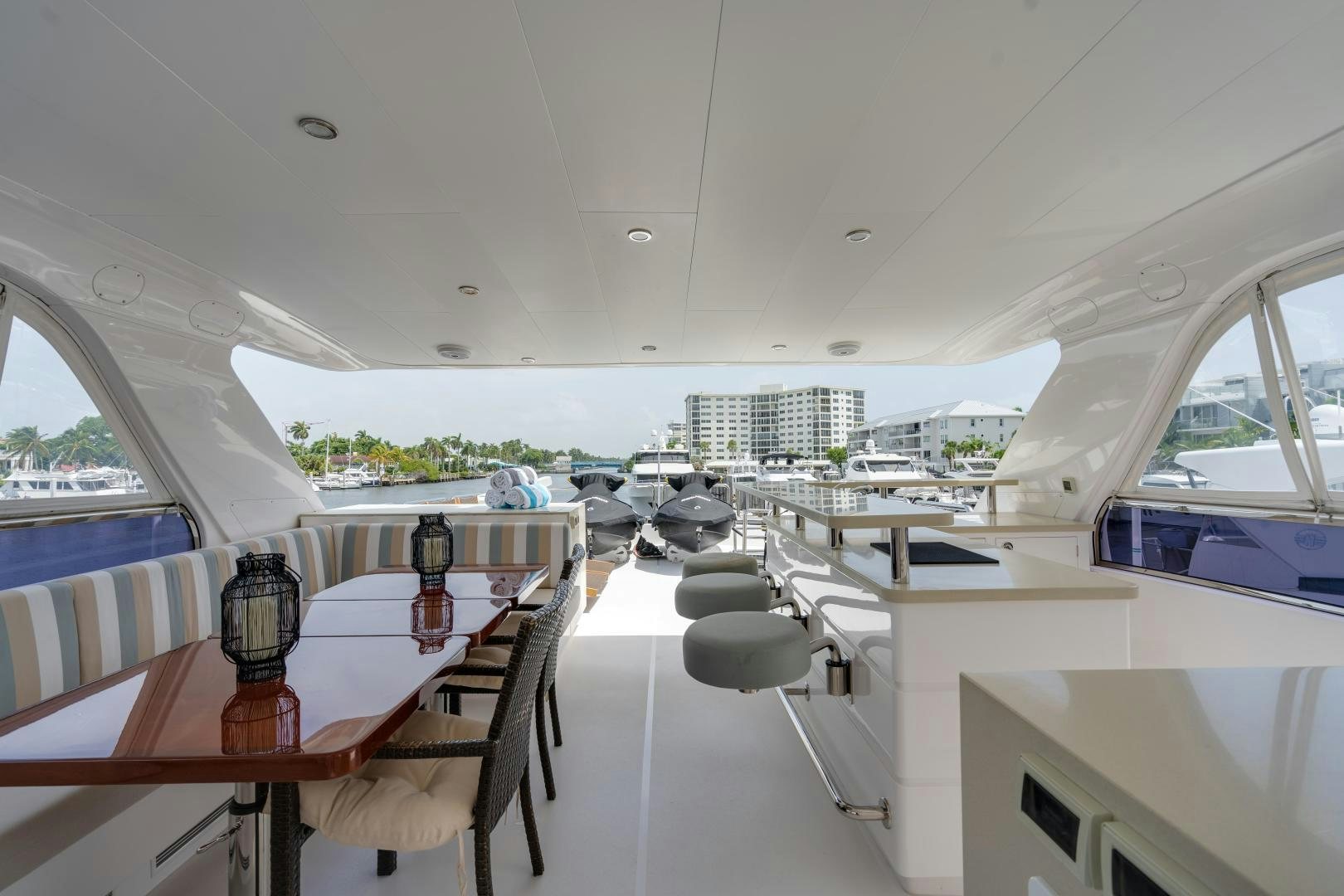 a room with tables and chairs aboard AQUA LIFE Yacht for Sale