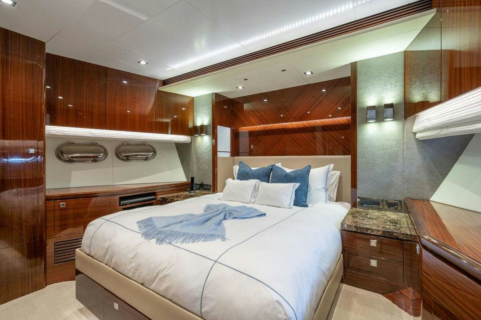 a bedroom with a bed and a sink aboard AQUA LIFE Yacht for Sale