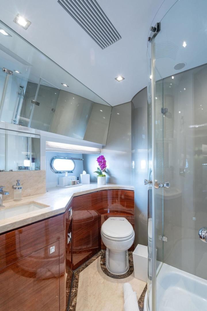 a bathroom with a glass shower aboard AQUA LIFE Yacht for Sale