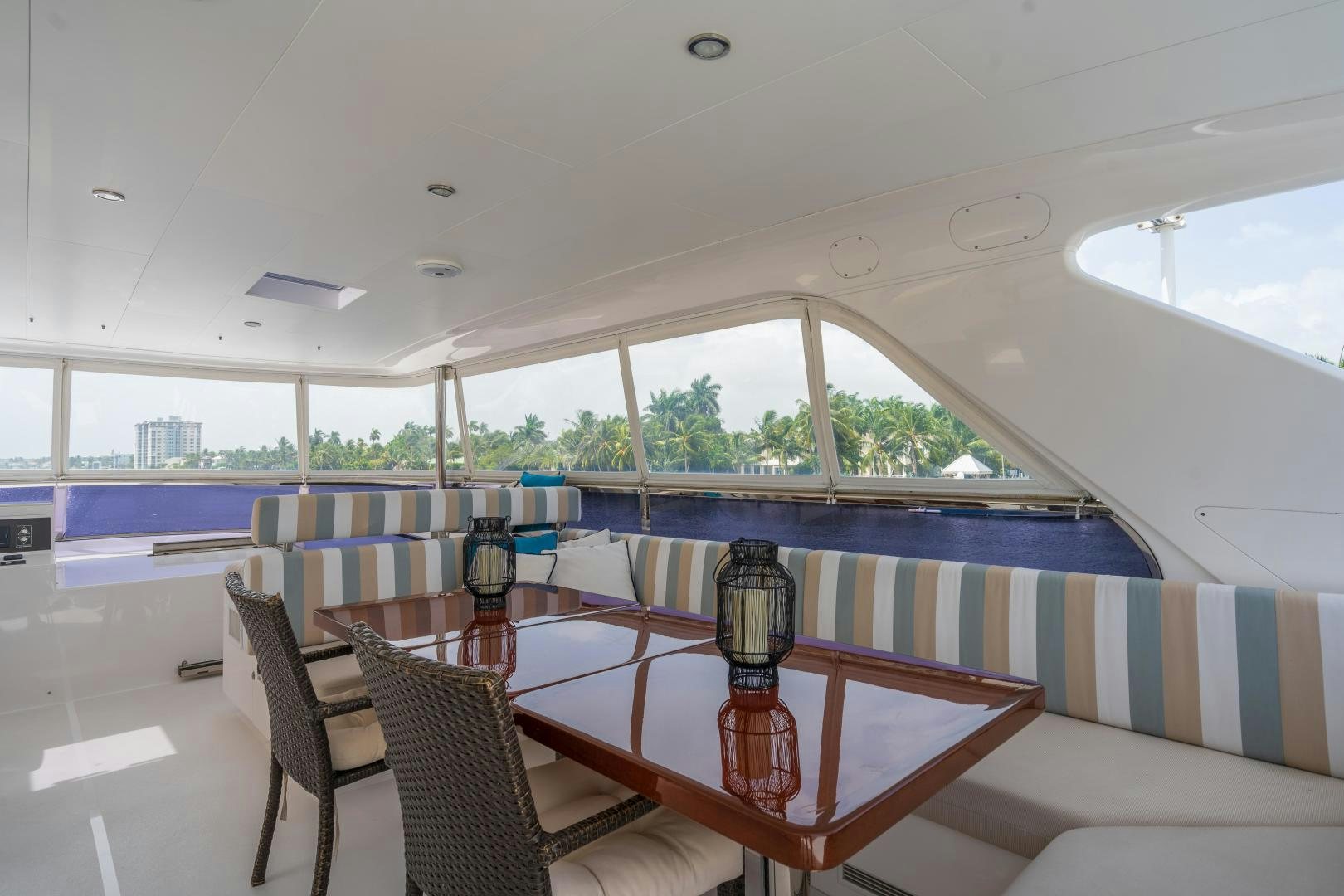 a table and chairs on a deck aboard AQUA LIFE Yacht for Sale