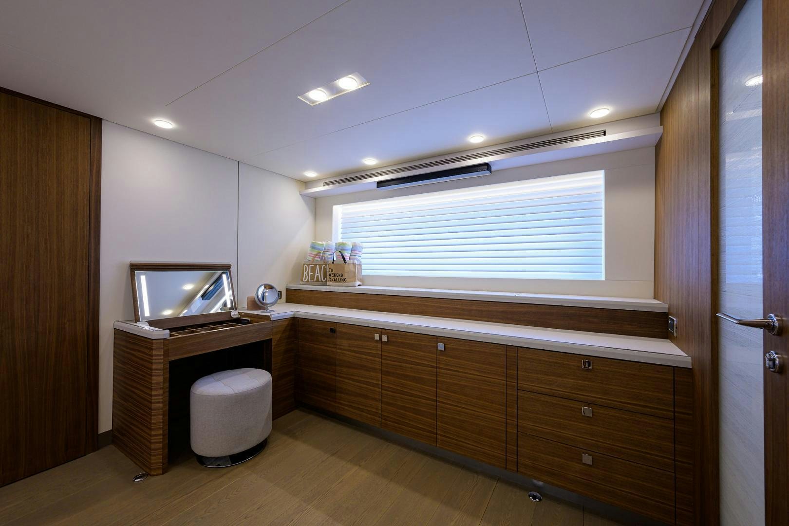 a room with a tv and cabinets aboard MY 3 GALS Yacht for Sale