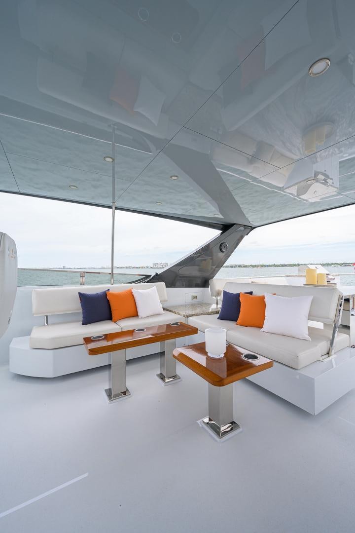 a room with a couch and a table aboard MY 3 GALS Yacht for Sale