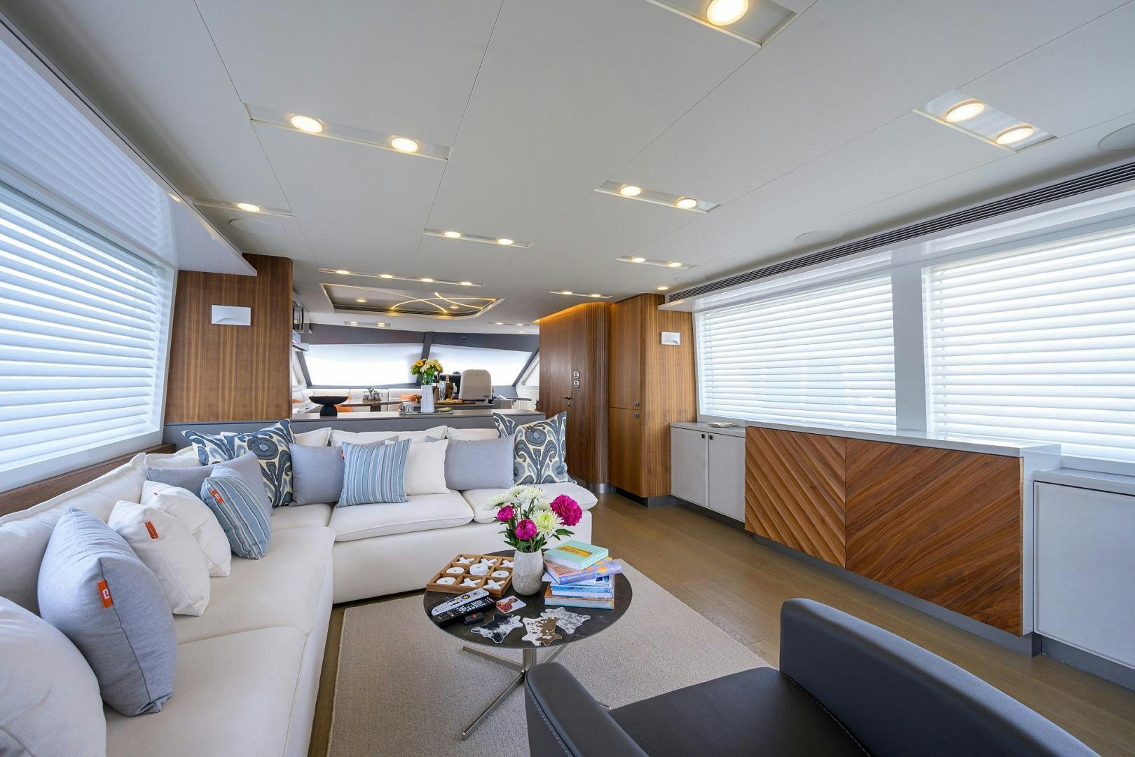 a living room with a couch and a coffee table aboard MY 3 GALS Yacht for Sale