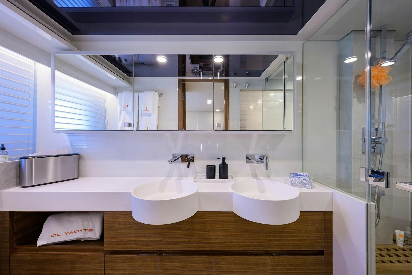 a bathroom with a large mirror aboard MY 3 GALS Yacht for Sale