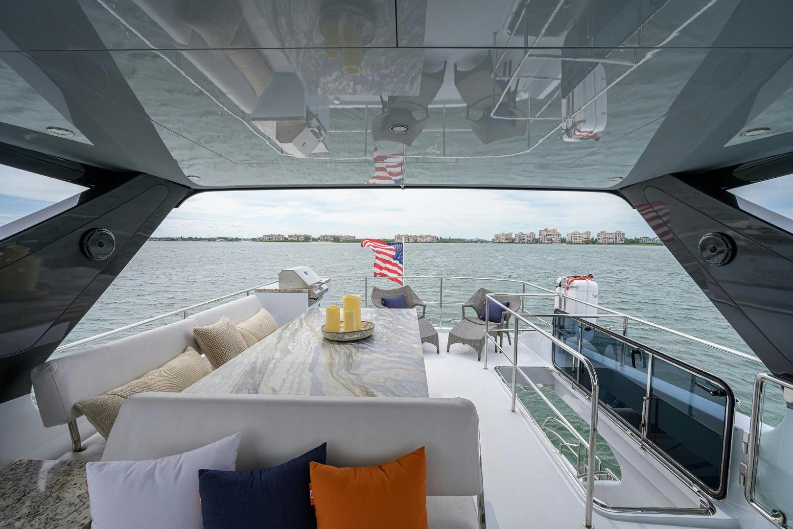a deck with a view of the ocean and the beach aboard MY 3 GALS Yacht for Sale